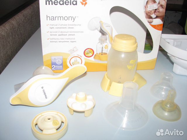 Молокоотсос Medela ручной б/у + соска Calma