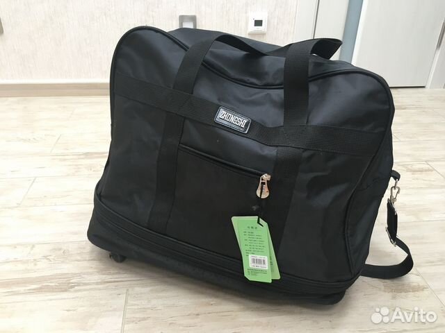 Сумка на колёсах, чёрная новая